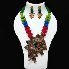 Handmade jewellery with thread beads and brass pendant