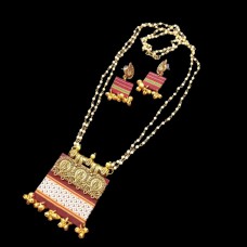 khun jewellery with off-white beads and golden ghungroos