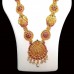 Temple Jewellery with Maata laxmi pendant adorned with matte rani & bottle-green stones