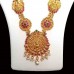 Temple Jewellery with Maata laxmi pendant adorned with matte rani & bottle-green stones