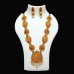 Temple Jewellery with Maata laxmi pendant adorned with matte rani & bottle-green stones