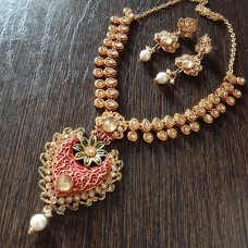 Golden stone necklace with red heart shaped pendant